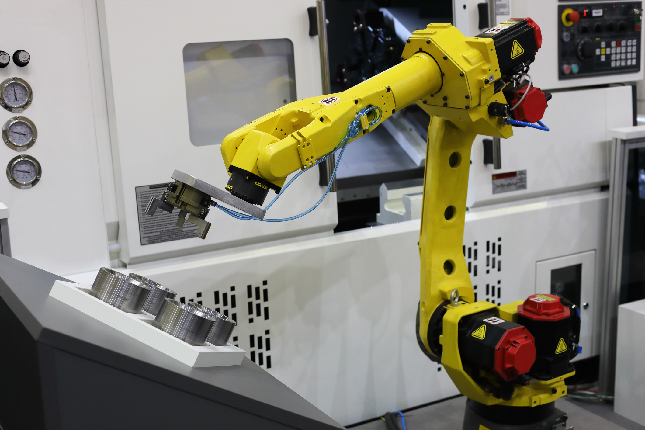 robot arm at a cnc machine